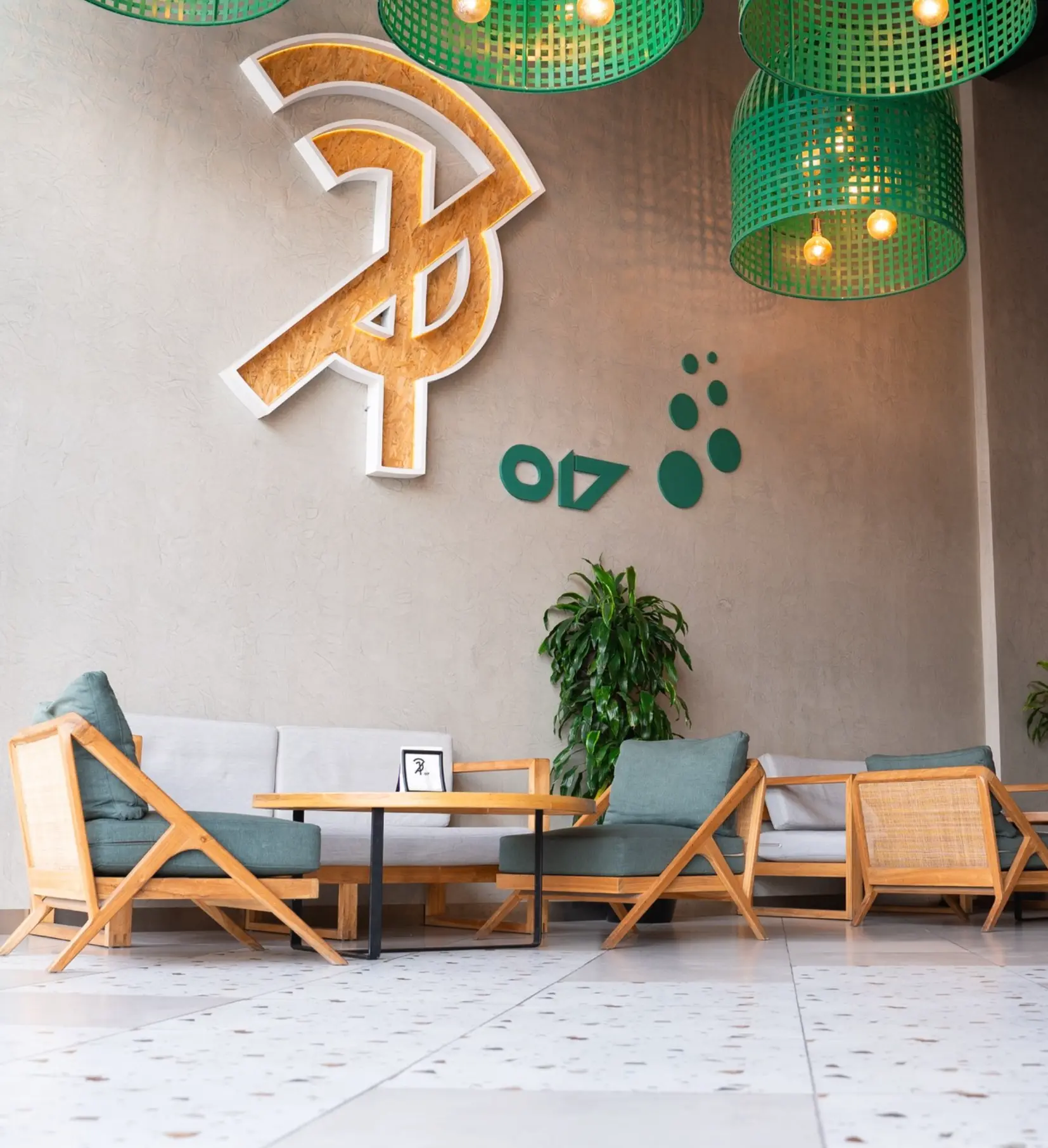 017 lounge with the logo wall